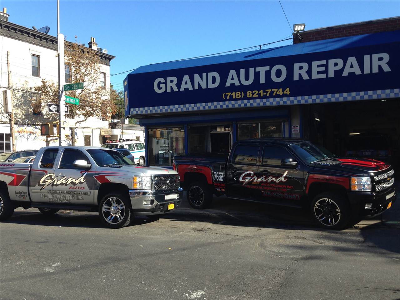Exterior of Grand Auto Repairs in Ridgewood with 2 trucks parked outfront