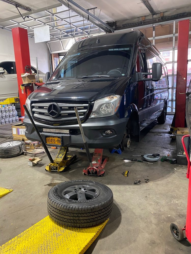 Vehicle on a car jack being worked on