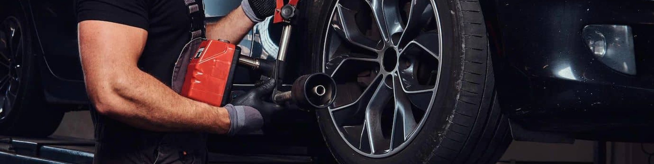 Mechanic working on car tire